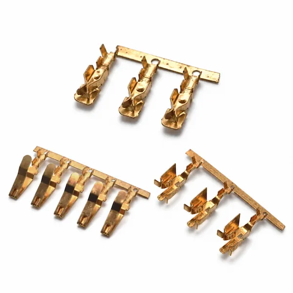 Three styles of metal terminals on carrier strips